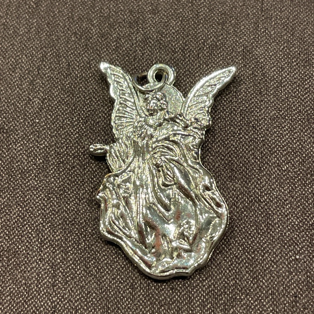 Silver coloured Winged Figure pendant